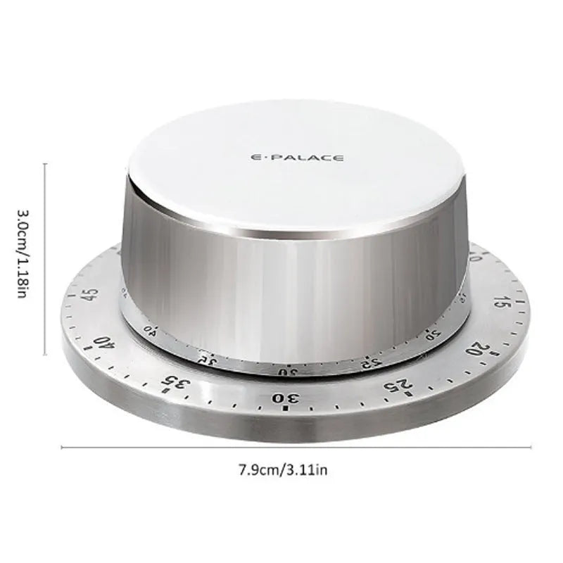 Green and silvery kitchen stainless steel mechanical timer with dial and magnetic back on fridge