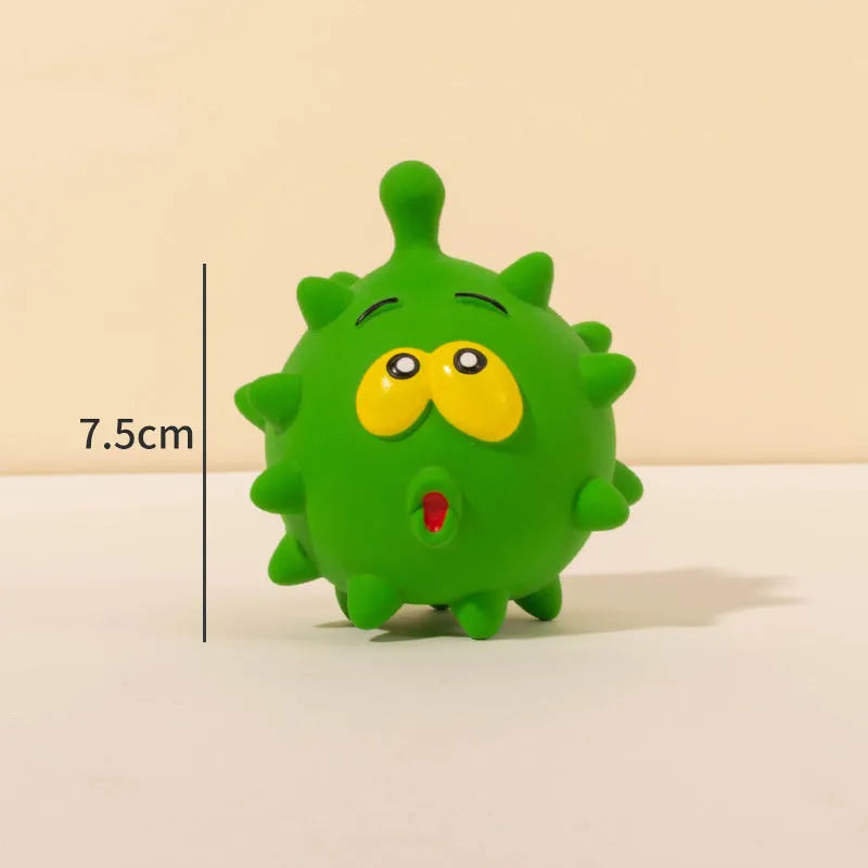 Set of four colourful squeaky dog balls with cute faces on a natural latex rubber texture.
