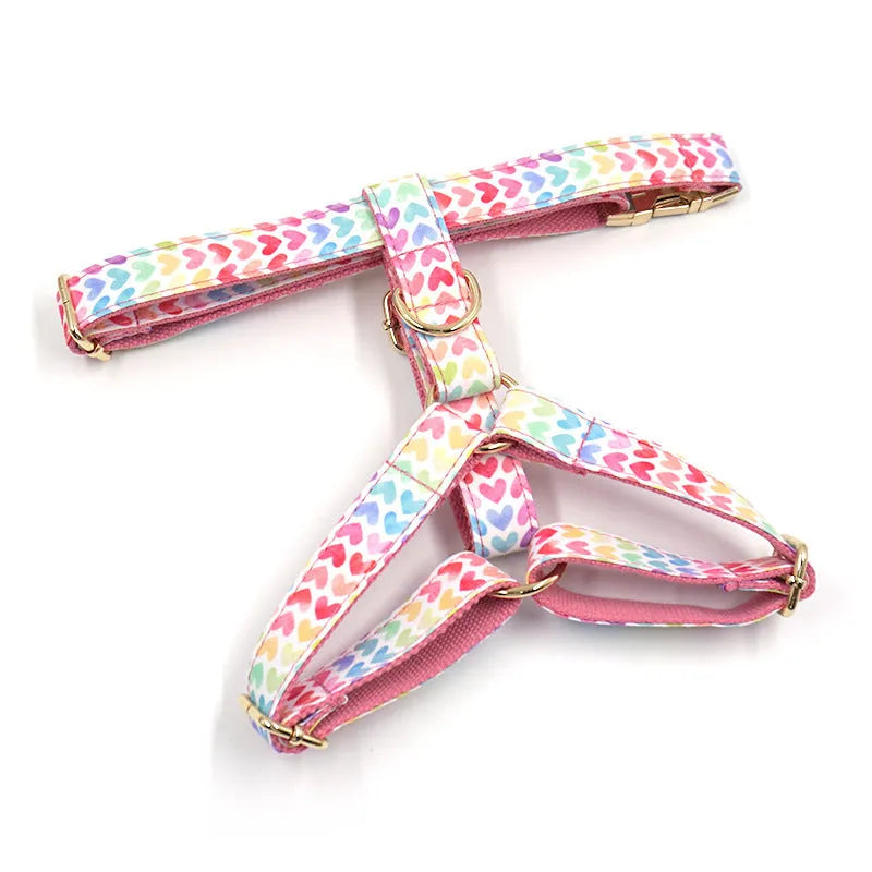 Pink colourful heart stone dog harness with gold buckle on a polyester chest and back strap.