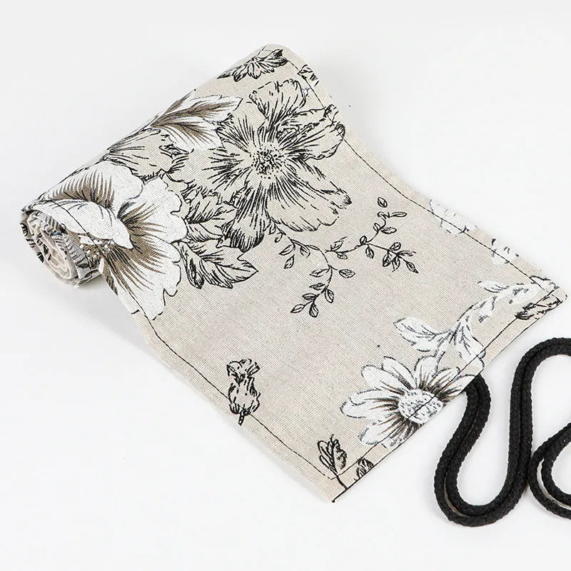 Black peony print canvas pencil roll bag showing cotton hemp construction with pencil storage holes