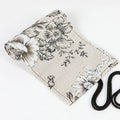 Black peony print canvas pencil roll bag showing cotton hemp construction with pencil storage holes