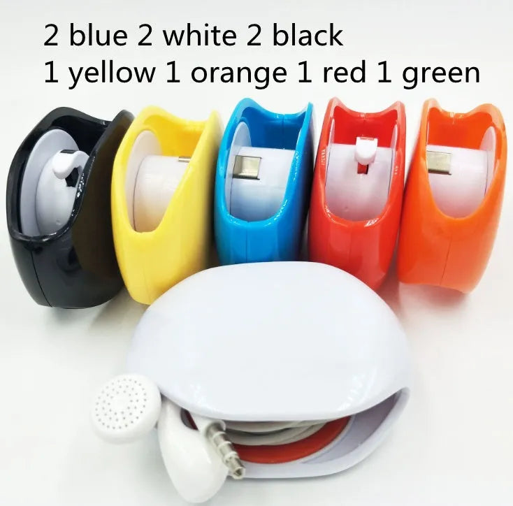Automatic earphone cable winder unit in blue showing retracted cable, next to a black unit for size comparison.