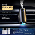 Obsidian black car aroma diffuser clipped to vehicle air vent with essential oil bottles