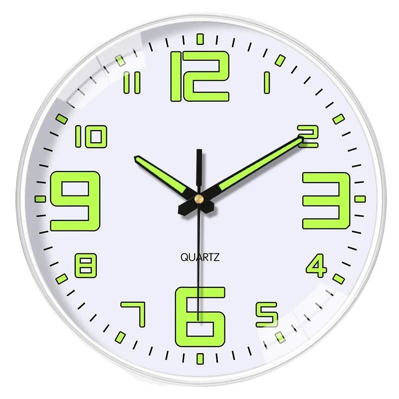Modern 8 inch luminous wall clock in plastic case on a wall.