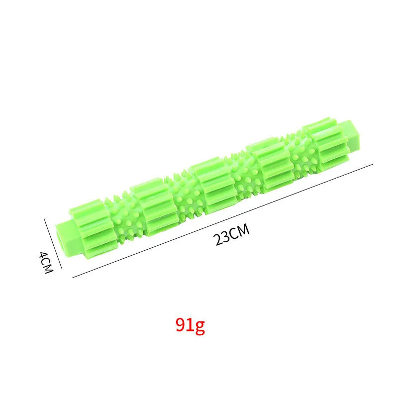 Green natural rubber dog chew toy with textured surface and hollow centre for treats.