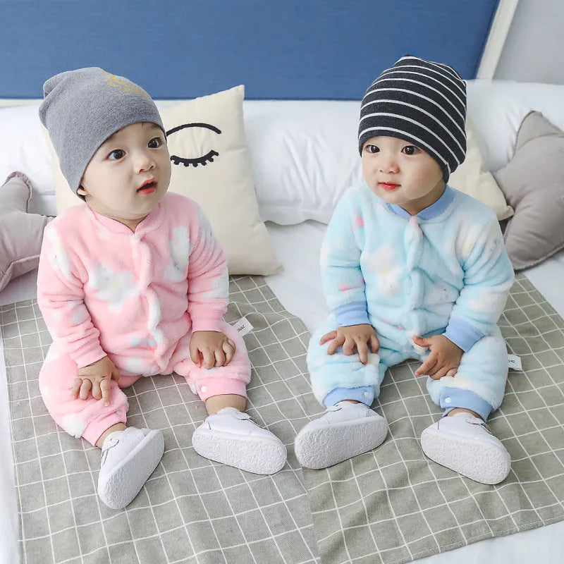 Baby wearing a long sleeve flannel romper with a printed panda pattern in pink and blue.