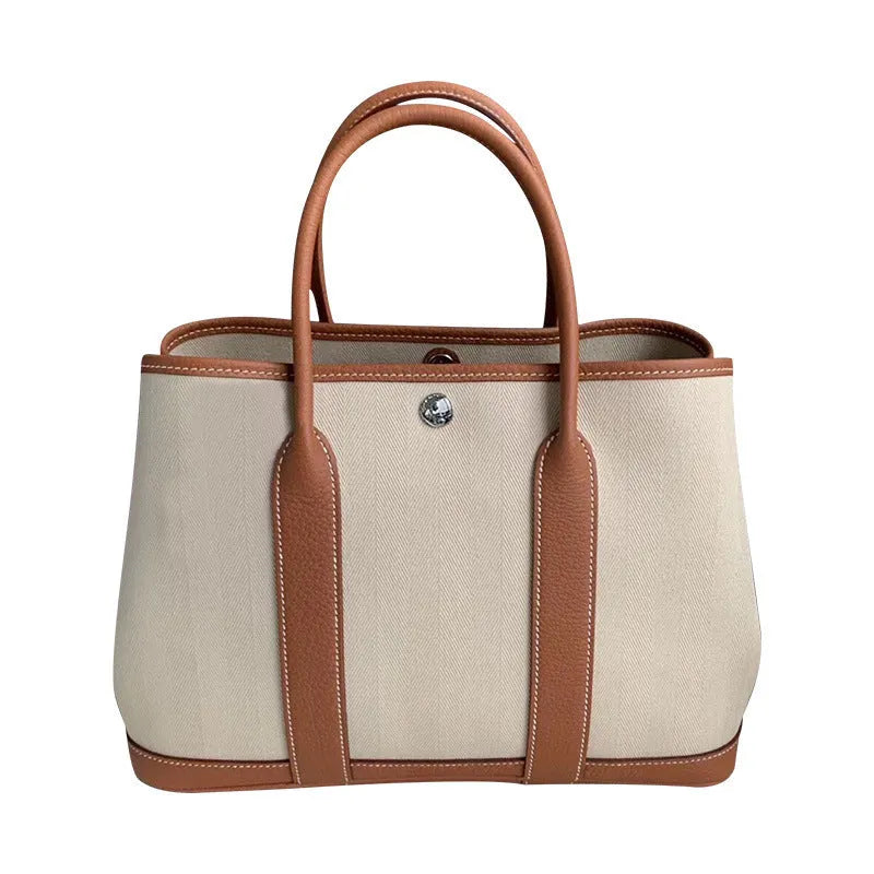 Women's canvas genuine leather bucket tote bag with crossbody strap and internal organisation pockets
