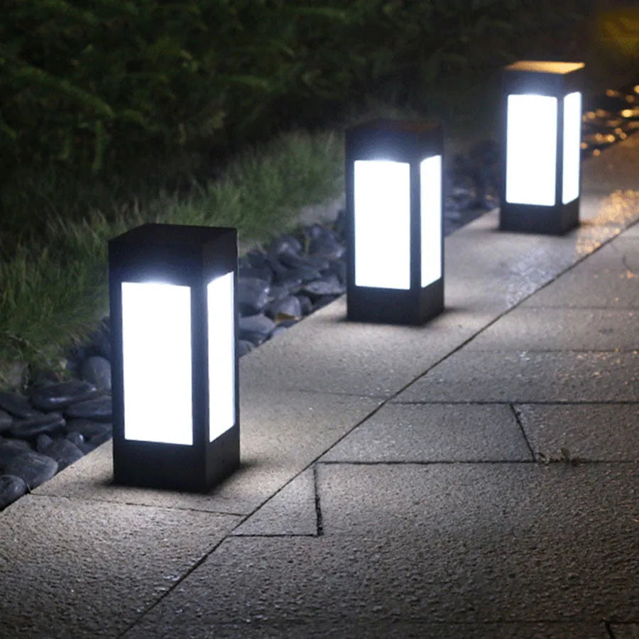 Waterproof solar garden light with LED, stake, and solar panel in a UK garden setting