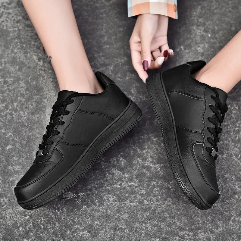 Pair of leather and nylon sneakers with rubber sole, available in black and white, sizes 35-46