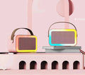 White, pink, and sky blue portable Bluetooth karaoke microphone speaker with coloured LED lights.