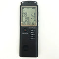 Compact USB digital voice recorder with external microphone on a desk.