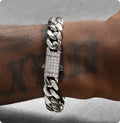8mm gold titanium steel Cuban bracelet on display with alloy gemstone inlay
