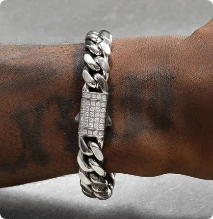 8mm gold titanium steel Cuban bracelet on display with alloy gemstone inlay