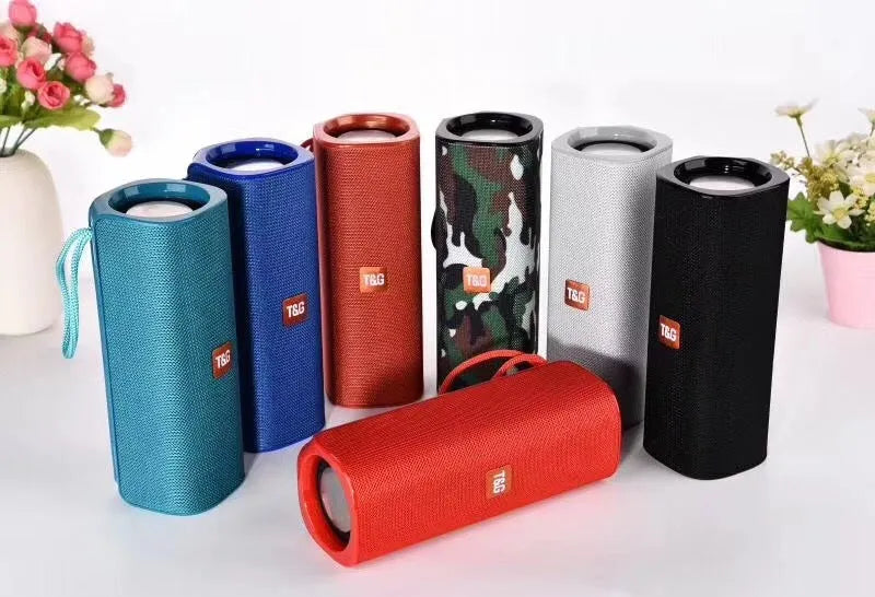 Cloth-covered portable wireless Bluetooth speaker with multiple colour options and control buttons