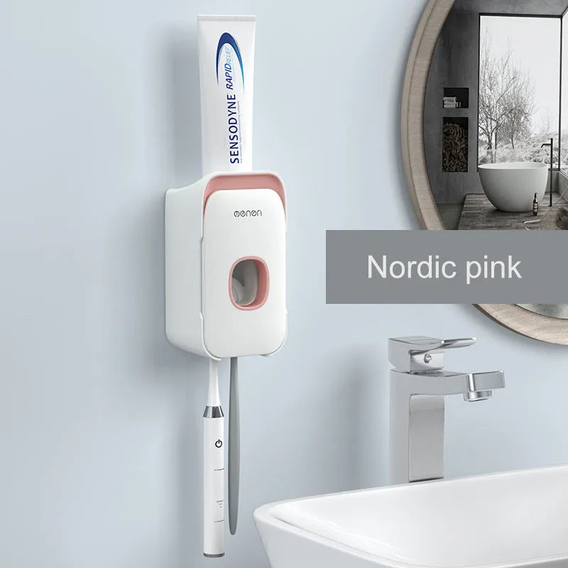 Blue, grey, and pink automatic toothpaste dispenser made of ABS plastic for wall mounting