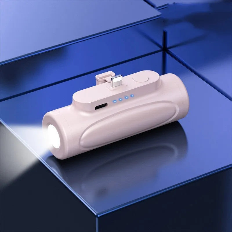 Black Creative Power Bank Glare Flashlight showing LED light on and compact 83mm size next to a mobile phone.