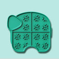 Gray silicone pet slow food pad with suction cups on tile floor, textured surface for licking