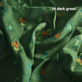 A piece of pure ramie embroidery fabric in a grass green colour, showing its woven texture.