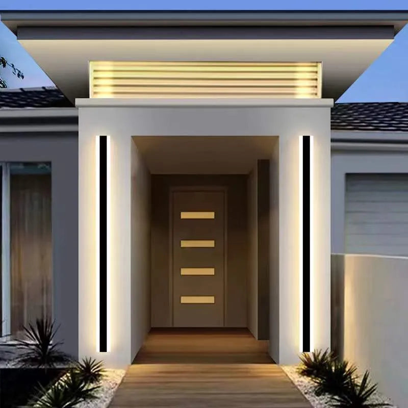 Outdoor waterproof LED wall lamp with linear design and IP65 rating on a wall.