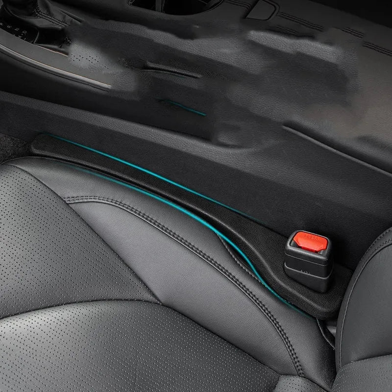Two flexible car seat gap sealing strips with handle, shown in selected colour