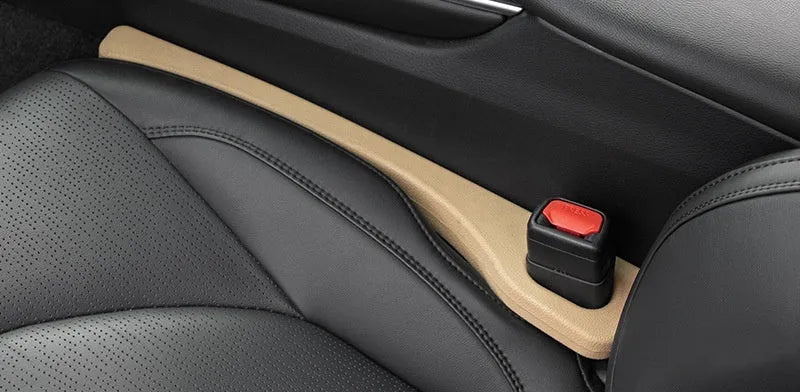 Two flexible car seat gap sealing strips with handle, shown in selected colour