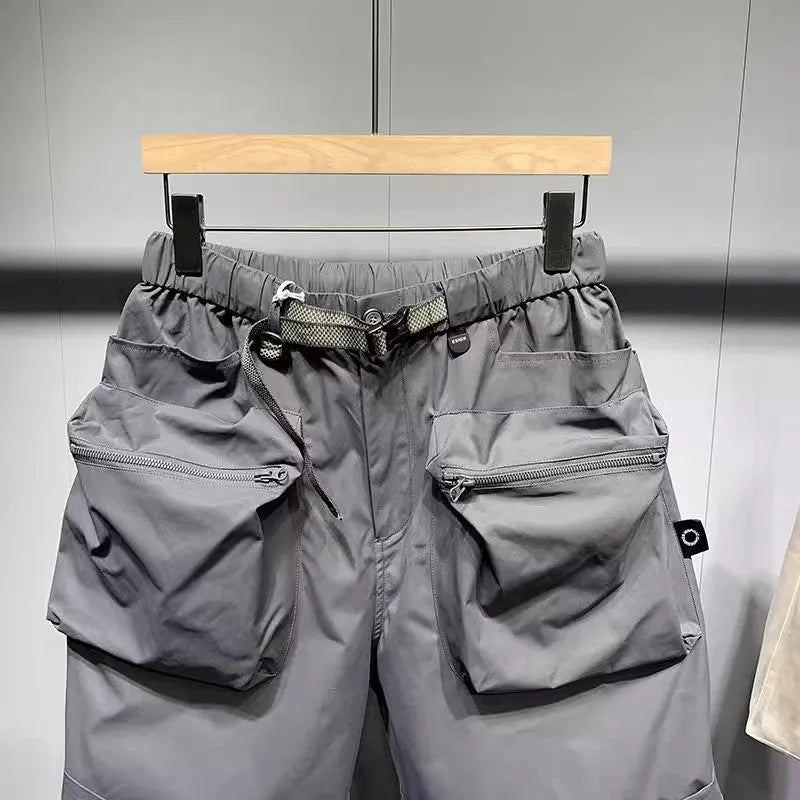 Men's loose-fitting casual shorts with multiple pockets in black or grey colours