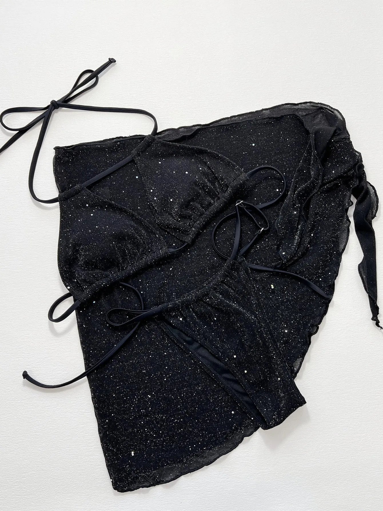 Black women's three-piece bikini set with separate top and shorts on a mannequin.