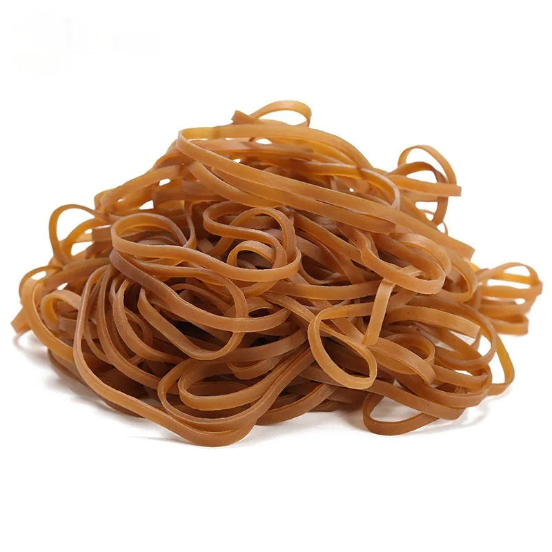 A bag containing numerous natural-coloured circular rubber elastic bands, total weight 500 grams.
