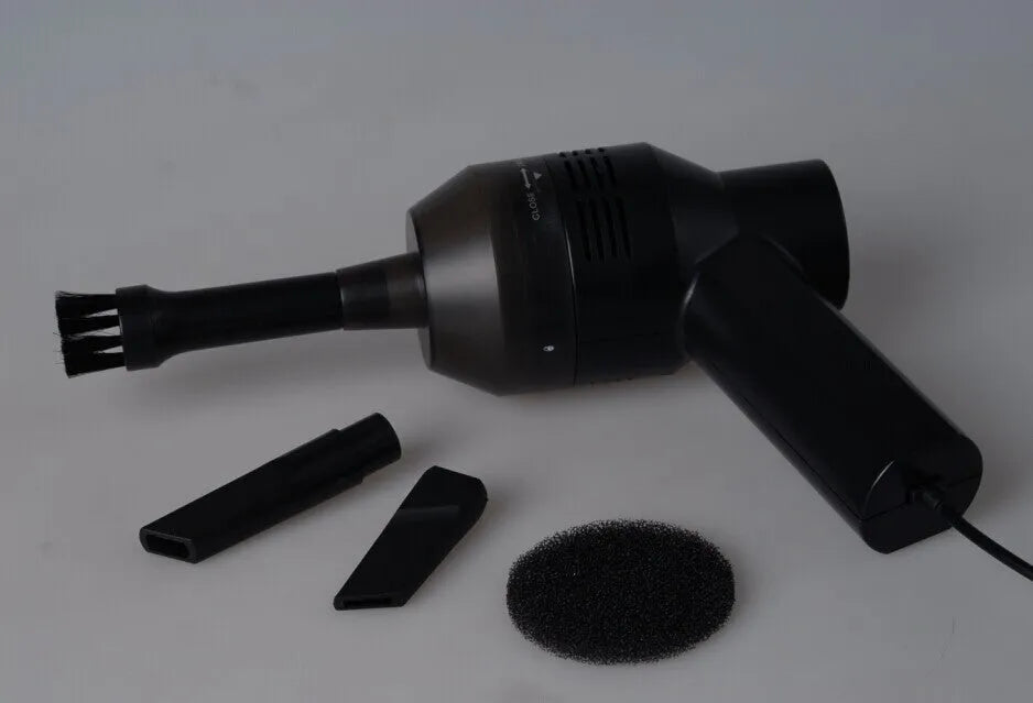 Black desktop mini vacuum cleaner with USB cable for computer keyboard dust removal
