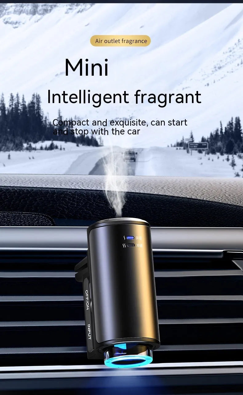 Obsidian black car aroma diffuser clipped to vehicle air vent with essential oil bottles