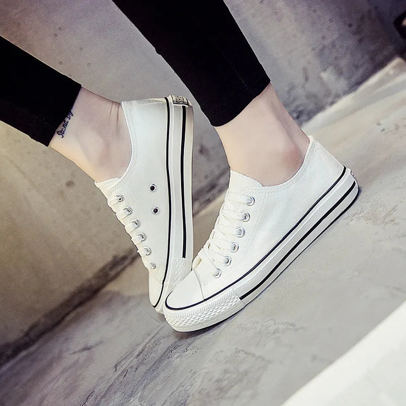 Women's solid-colour canvas shoes in black, white black, white red, or all black colour options