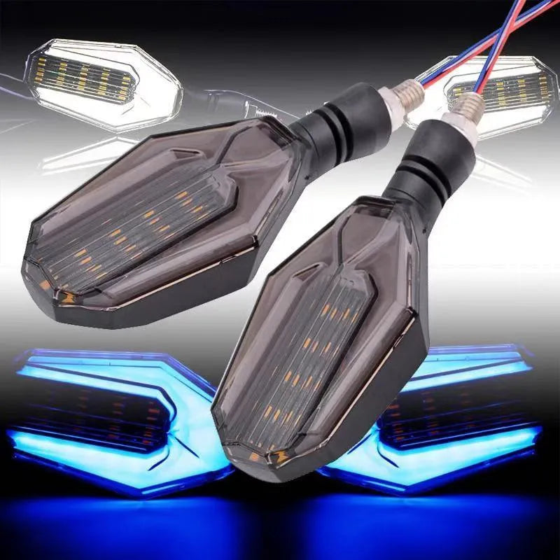 Pair of motorcycle indicator lights with coloured light guides on a black ABS acrylic housing.