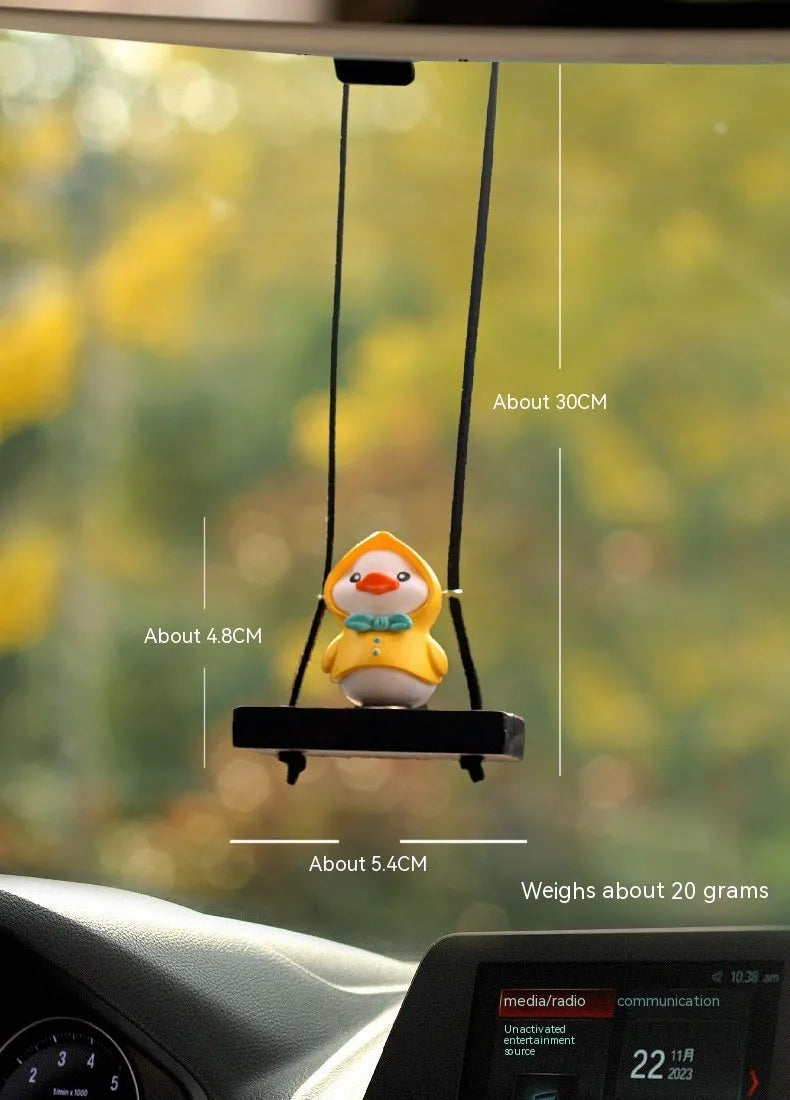 Yellow plastic duck car hanging ornament in four cartoon design styles.