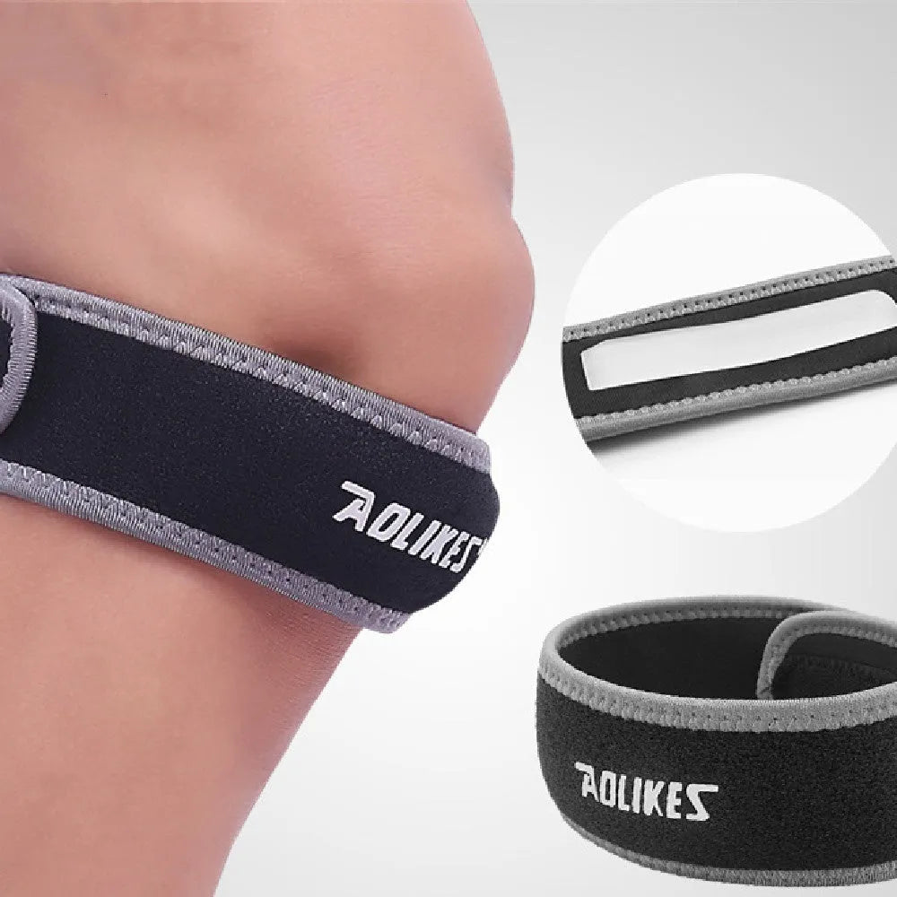 Black and grey adult patella retinaculum knee support strap for sports