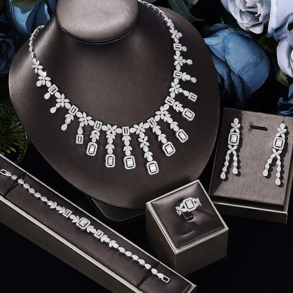 White copper inlaid zircon four piece jewellery set with love heart, water drop, and bell patterns including necklace, earrings, bracelet, and ring