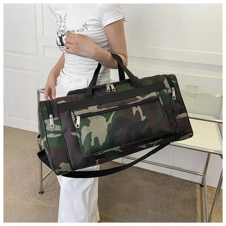 Large camouflage coloured waterproof luggage bag with striped polyester lining.