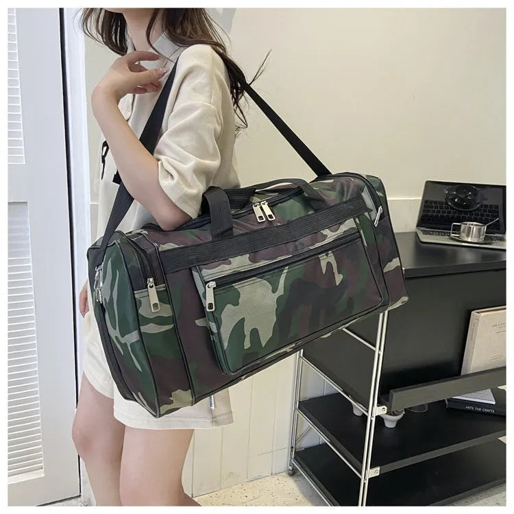 Large camouflage coloured waterproof luggage bag with striped polyester lining.