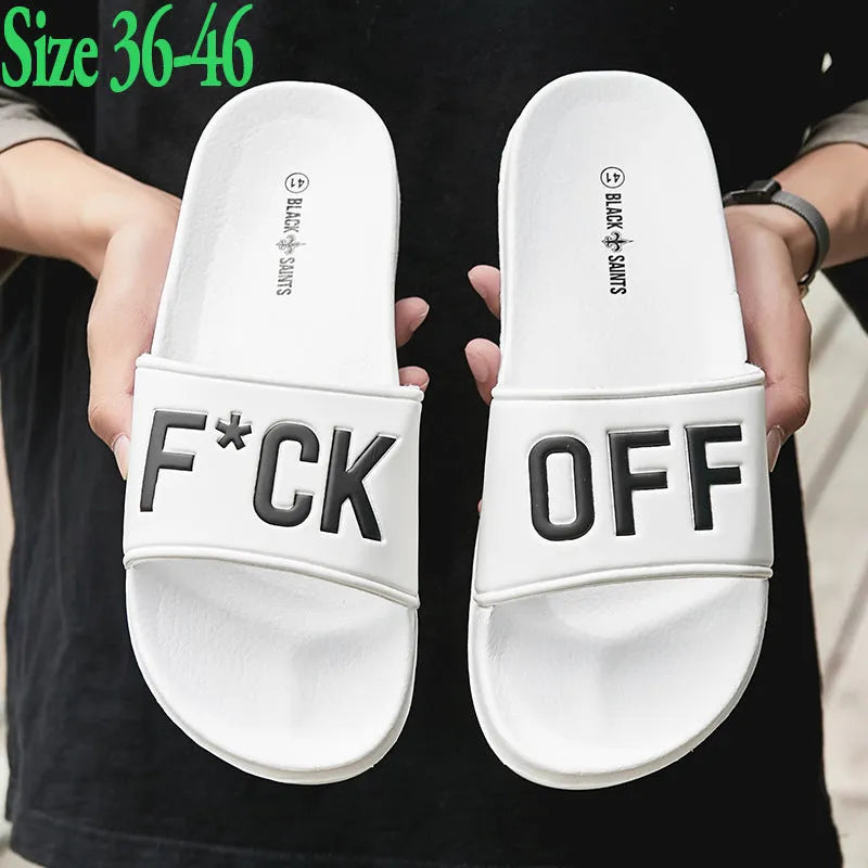 Black and white open-toe men's slippers with a rubber sole, shown on a size chart from 36 to 46.