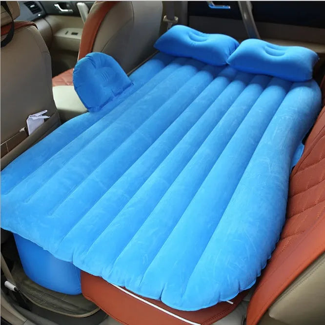 Black thickened flocking inflatable car bed set up in a vehicle with pillows.