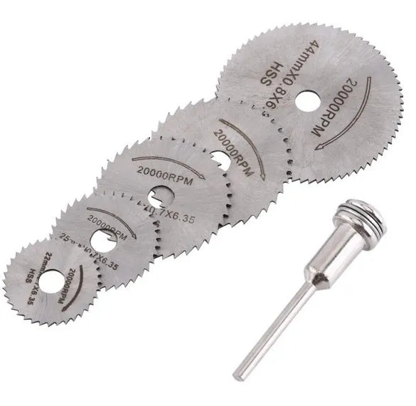 Six high-speed steel circular saw blades and a mandrel arranged on a surface.