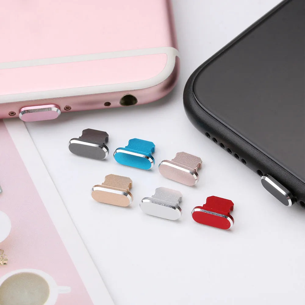 Aluminium alloy charging port dust plug for iPhone in various metallic colours including gold and rose gold.