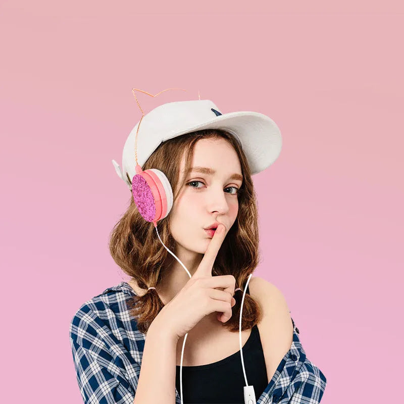 Wired over-ear headphones with microphone in black, blue, pink or yellow colour options on a white background