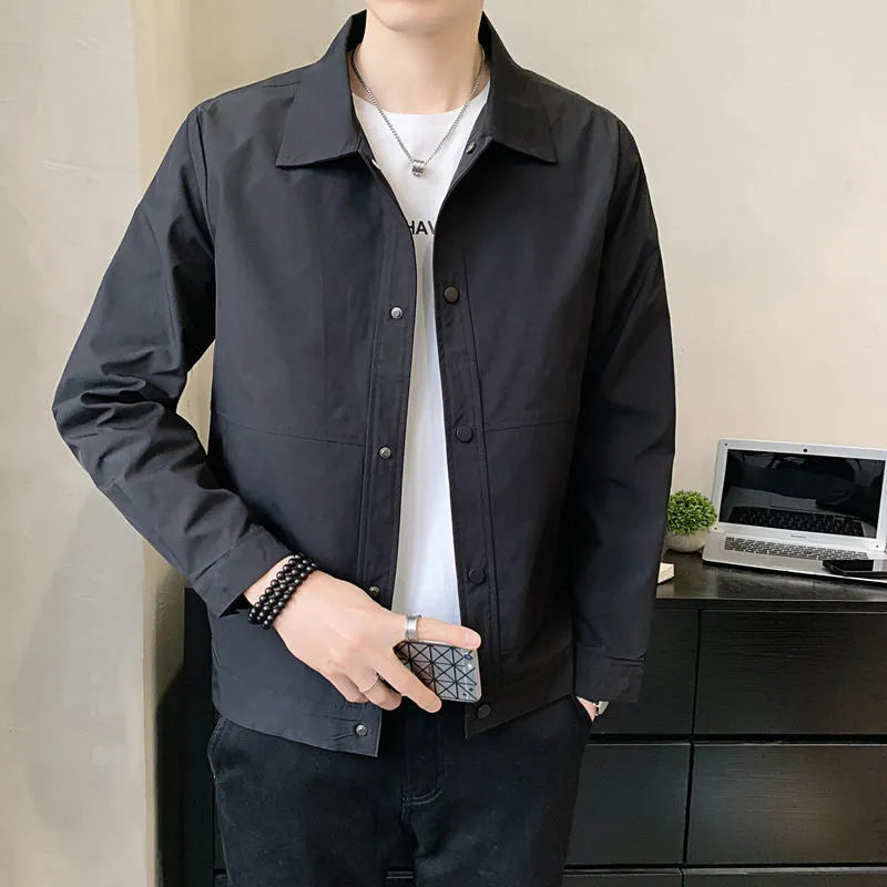 Men's Korean style single-layer lightweight jacket in blue grey, showing long sleeves and stitching detail.