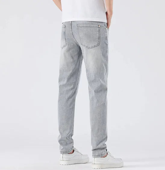 Men's light wash slim straight leg jeans in light grey cotton with no-iron finish