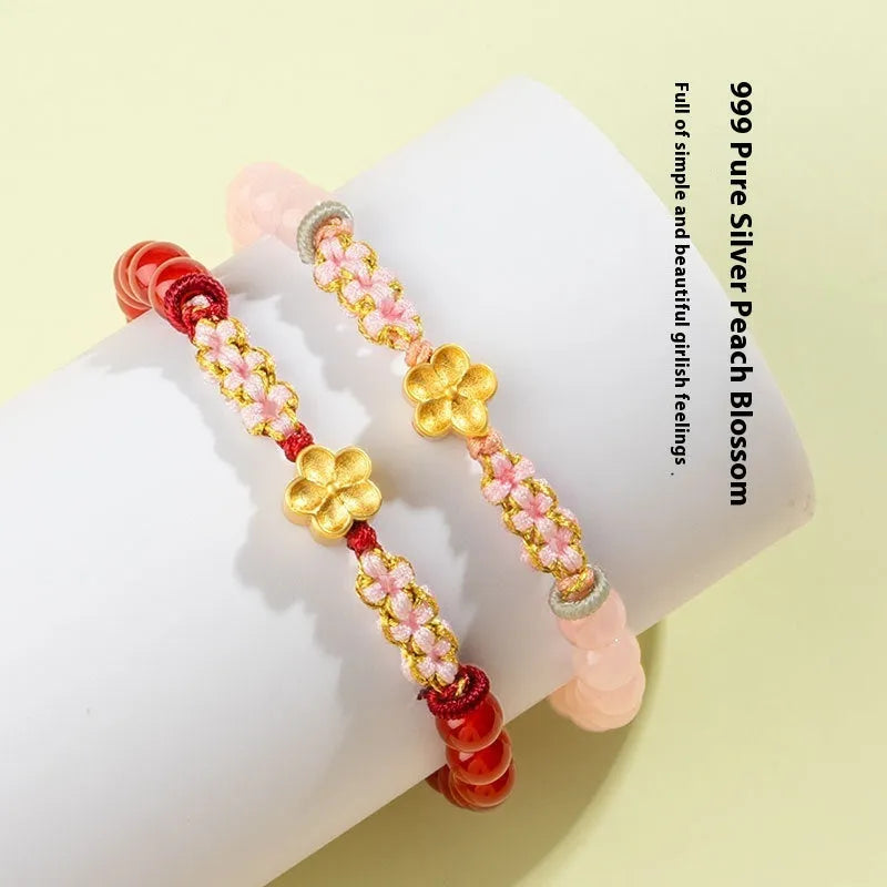 Chinese style women's bracelet with hand-woven red rope and peach blossom crystal charms