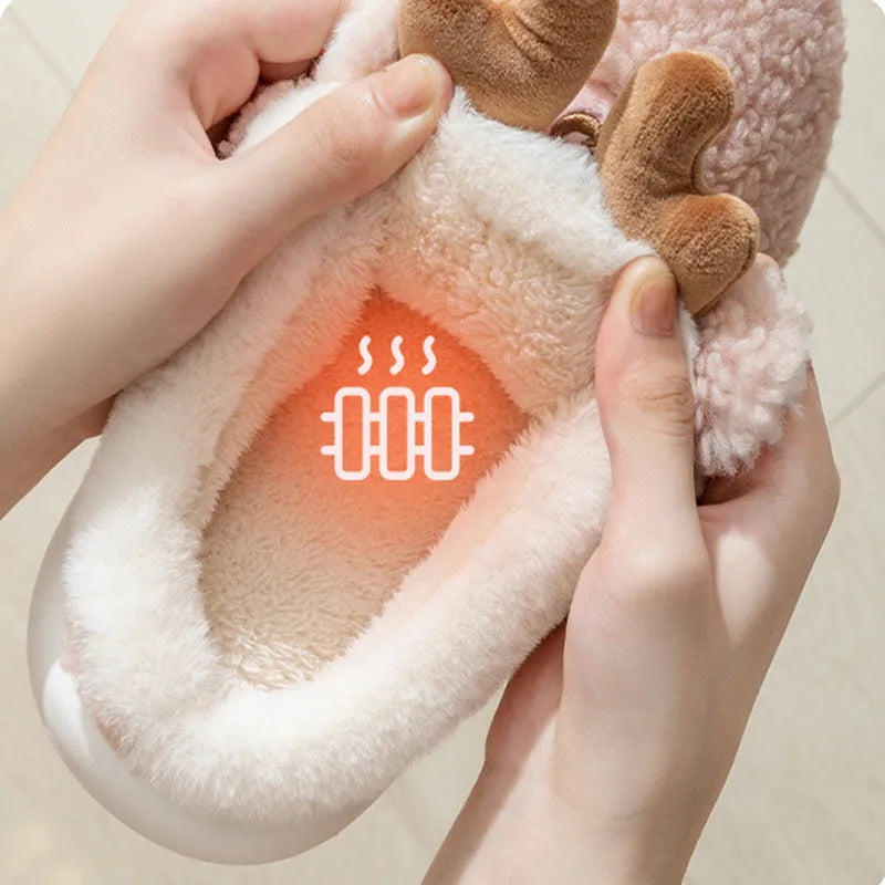 Christmas elk winter home slippers in pink with suede upper and thickened EVA sole on a cream background