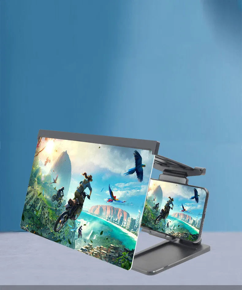 Black foldable mobile phone screen amplifier and detachable holder set up on a desk.