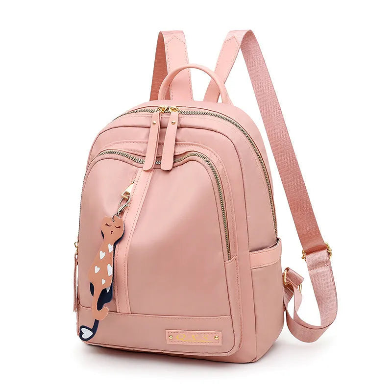 Black square nylon casual backpack with double shoulder straps and a front pocket.