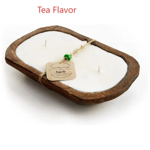 Lavender-scented soy wax candle in a wooden basin with a wooden wick