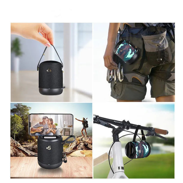 Small black portable Bluetooth speaker with carrying handle, showing FM radio and card slot features.